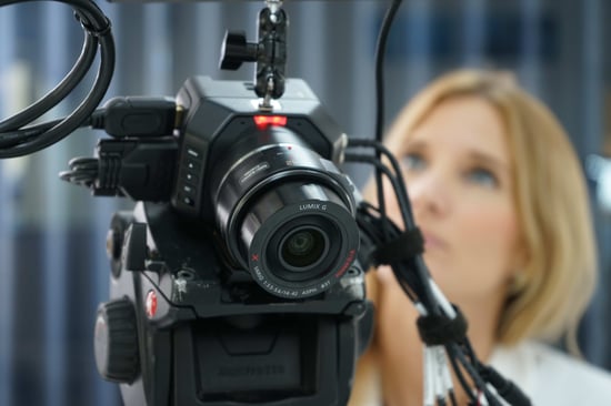 Woman next to camera